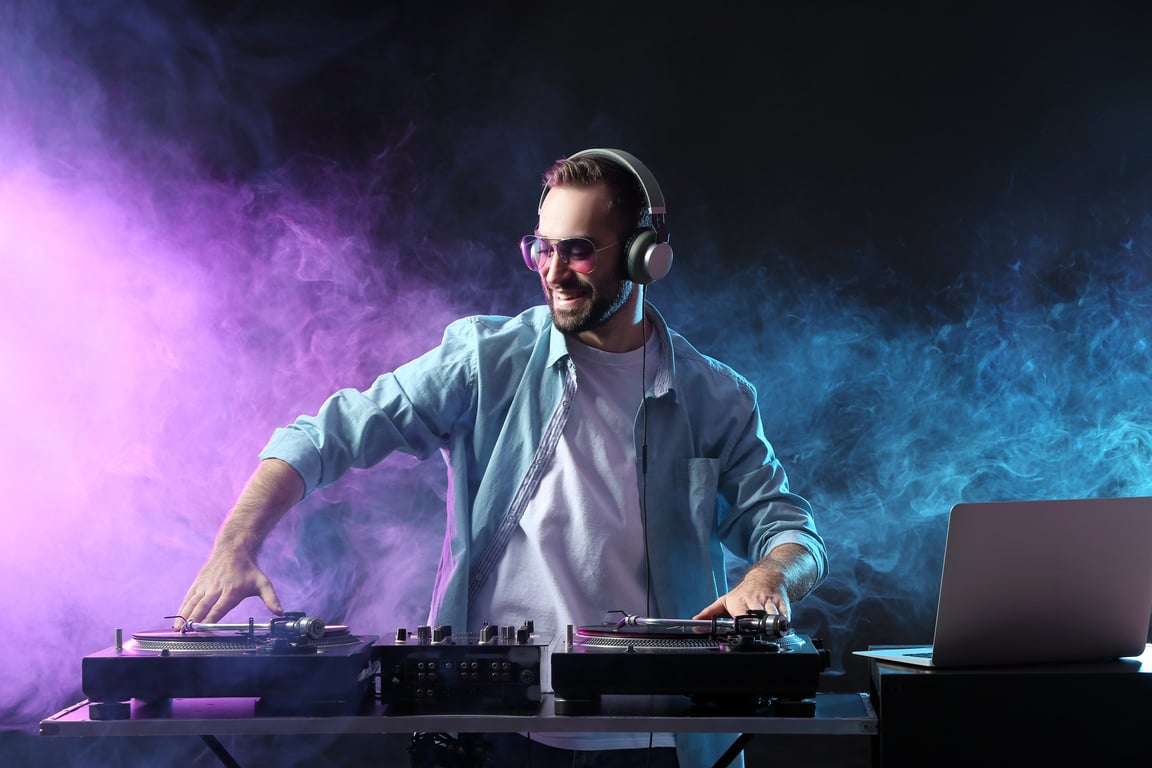 Male DJ Playing Music in Club