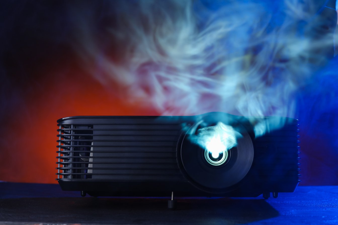 Video Projector and Smoke on Dark Background