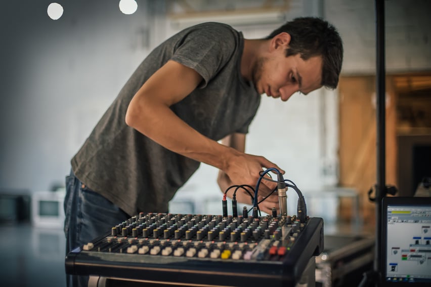 Behind the scene. Sound technician electric engineer adjusting sound elements