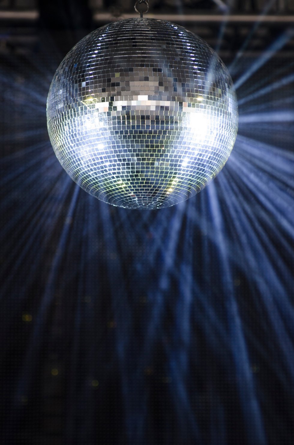 A glittering disco ball in the middle of the dance floor